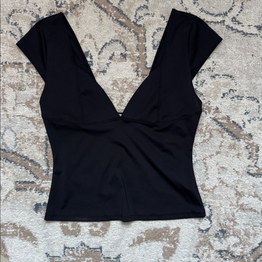 Black going out top